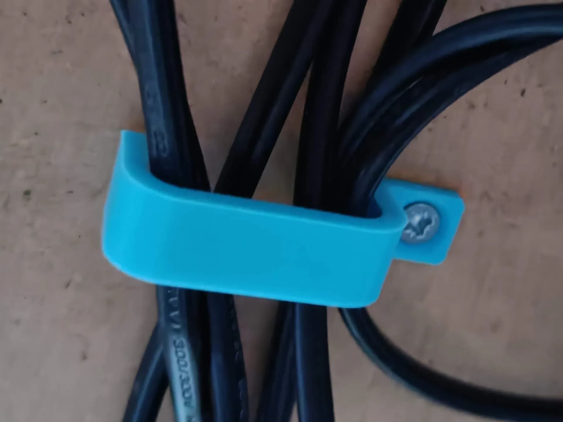 Cable management under desk bracket