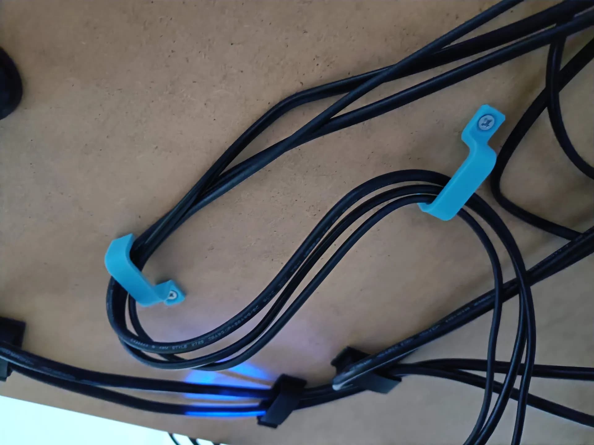 Cable management under desk bracket