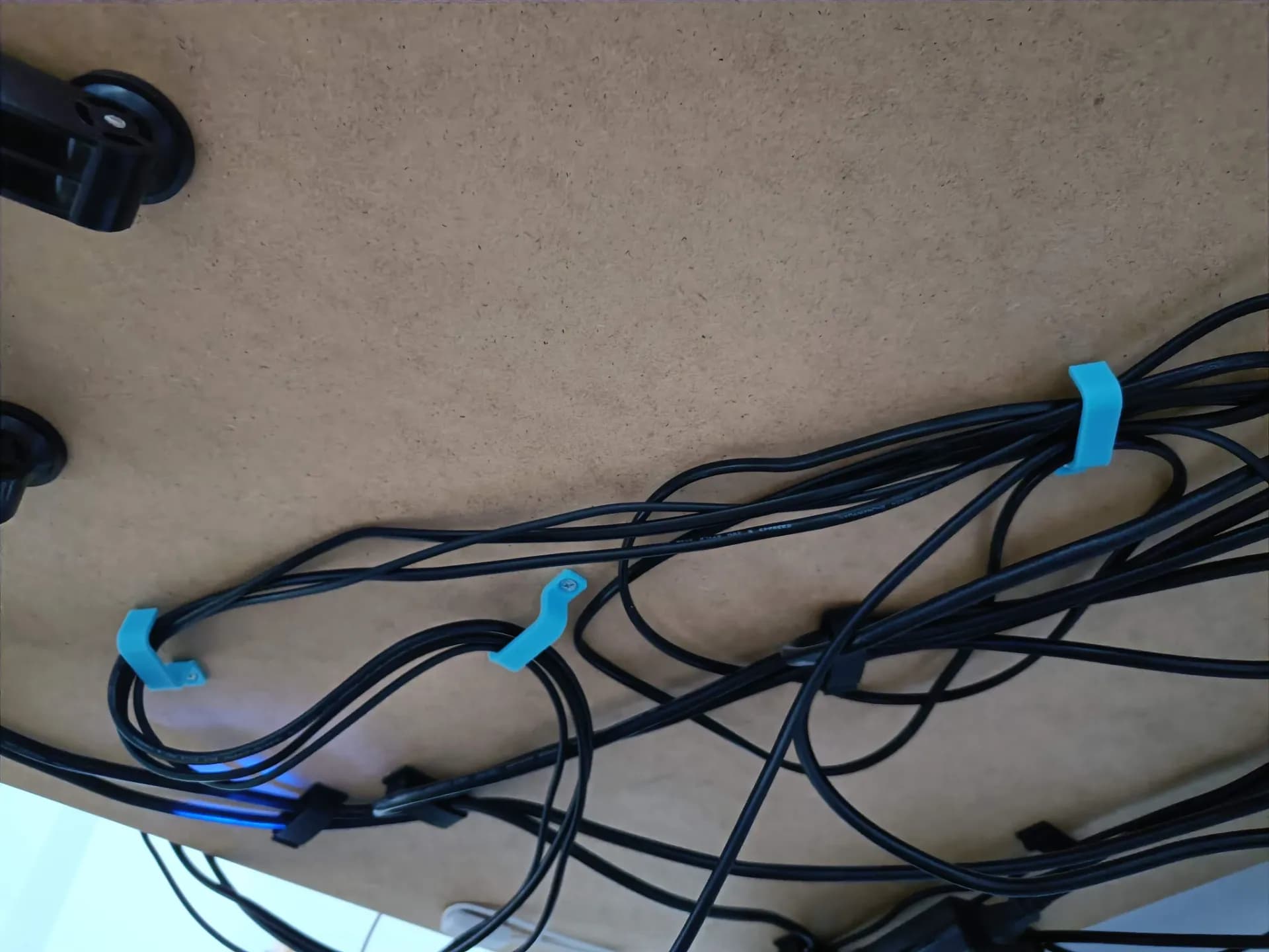 Cable management under desk bracket